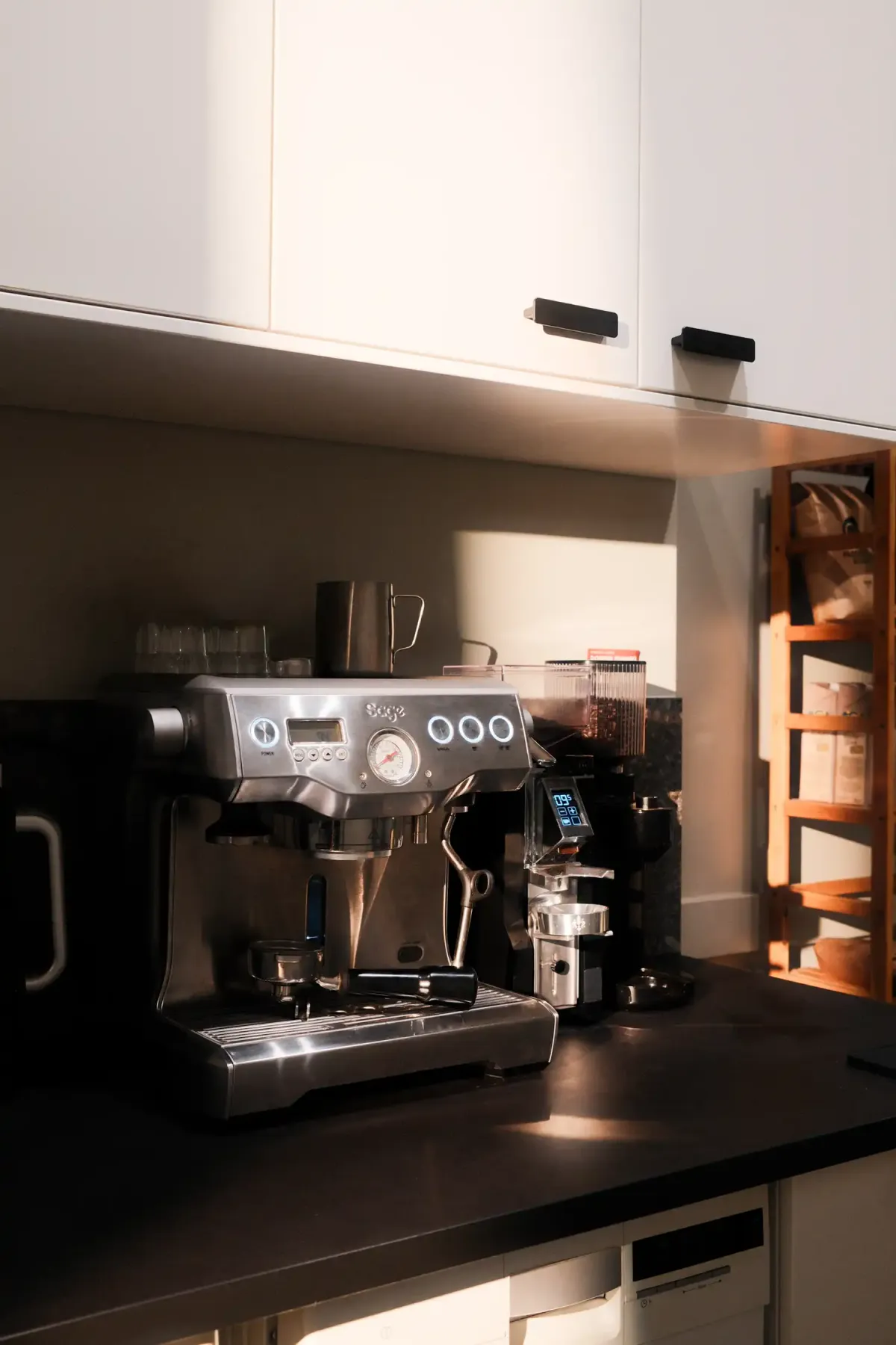 Professional espresso machine with coffee grinder in a modern office kitchen